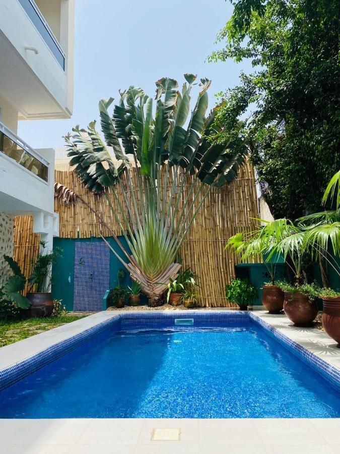 L'Oasis Guesthouse Cotonú Exterior foto